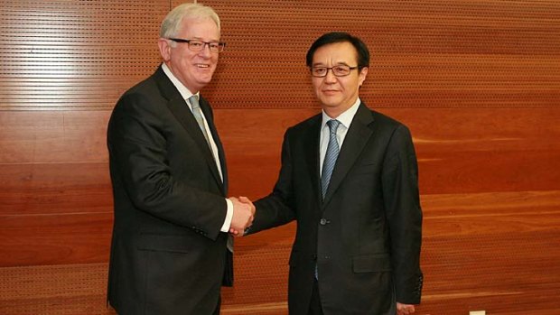 "We feel we've got a way through": Andrew Robb with China's Commerce Minister Gao Hucheng.