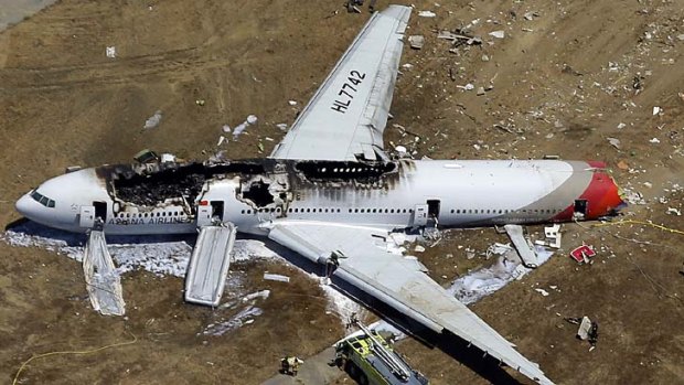 The wreckage of Asiana Flight 214 lies on the ground after it crashed at San Francisco airport.