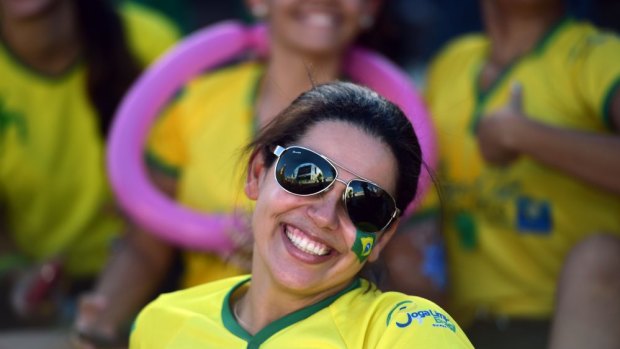 A Brazilian fan watches a live screening of her team's match against Croatia at the Fans Fest in Cuiaba.