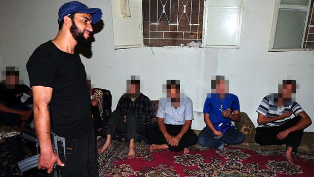 Awaiting sentence &#8230; some of the prisoners in the charge of Abu Haytham, the commander of the Eagle Coast Brigade.