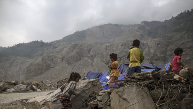 Children next to their makeshift shelter near a landslide area after the earthquake at Jure village in Sindhupalchowk, Nepal.
