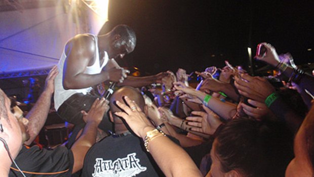 Security moves in as US rapper Akon launches himself into the crowd at urban music festival Supafest at the RNA Showgrounds on Saturday night.