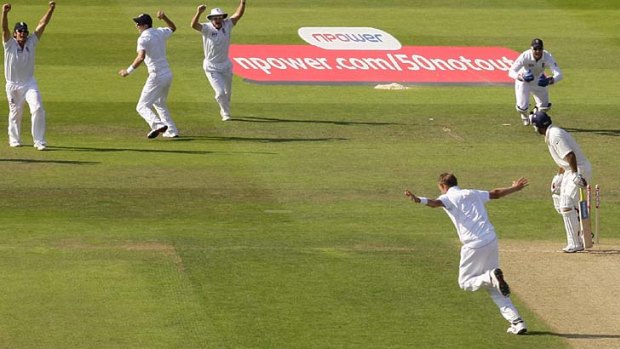 England's Stuart Broad, bottom right, celebrates his hat-trick with the wicket of India's Praveen Kumar on the second day of their Test match at Trent Bridge.