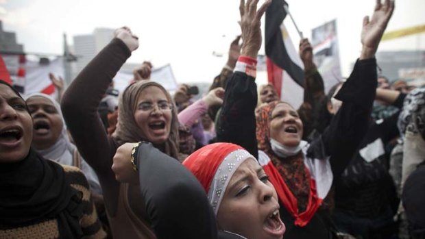 Divided ... Egyptian women protest in Tahrir Square, some have chosen to boycott the first round of parliamentary elections.