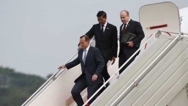 Touchdown: Tony Abbott arrives in Indonesia on Sunday for the inauguration of Joko Widodo.