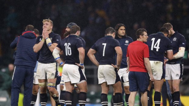 Heartbreak: Scotland react after Bernard Foley's last-gasp penalty.