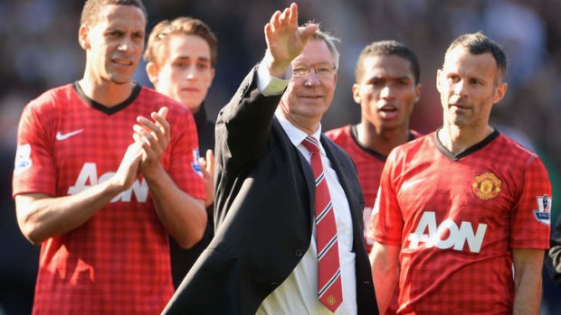 Former Manchester United manager Alex Ferguson is flanked by Rio Ferdinand and Ryan Giggs after his 1,500th and final match in charge of the club.