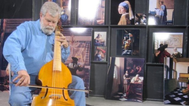 In notable footsteps: Inventor Tim Jenison plays a viola used to furnish the Vermeer room in his Texas warehouse in a scene from the film .