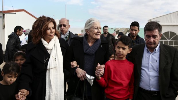 Vanessa Redgrave is escorted by Athens' Mayor Giorgos Kaminis (right) and Greek actress Mini Denissi at Eleonas refugee camp in 2016.
