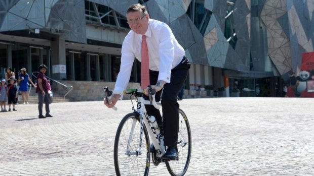 The Premier gets on his bike at Fed Square.