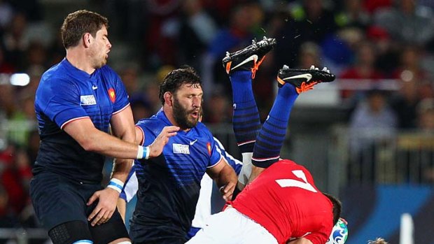 Red-card offence ... Sam Warburton of Wales up-ends Vincent Clerc of France.