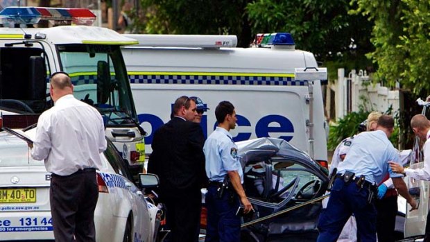 Crash scene &#8230; the wreckage after a police vehicle crashed into an elderly woman's car at Bankstown yesterday.