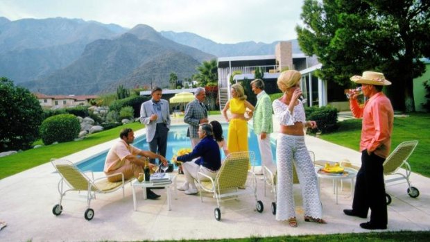 Poolside party 1970 at Richard Neutra's Kaufmann Desert House in Palm Springs, California. Designer Raymond Loewy stands second from left