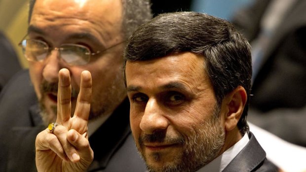 Mahmoud Ahmadinejad, President of Iran, flashes a peace sign from the floor of the General Debate of the 66th General Assembly session at the United Nations in New York.