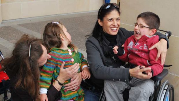 Corrina Parsons with daughter Isobel, 4, and Linda Pierce with son Harrison, 6.