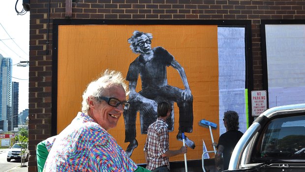 Step 8: One thing leads to another: Helen and Quincy from Bakehouse Studios want to use my image as a poster on the office of Music Victoria. This is Ross at the pasting up. "I thought it was going to be as tall as the building," he says before agreeing it's still pretty big.