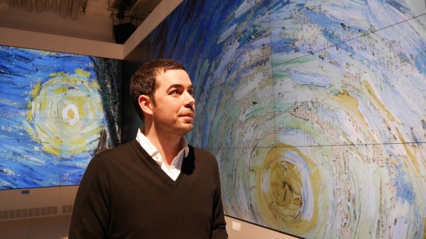 Laurent Gaveau, director of "Le Lab", with an enlarged section of Van Gogh's <i>Starry Night</i>.