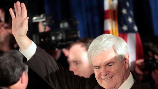 Buoyant ... Newt Gingrich at a primary night rally in Columbia, South Carolina. His win is a big setback for the Romney campaign.