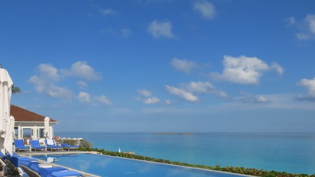 At the new beachside infinity pool, butlers offer bunches of frozen grapes, cool towels and lemonade.