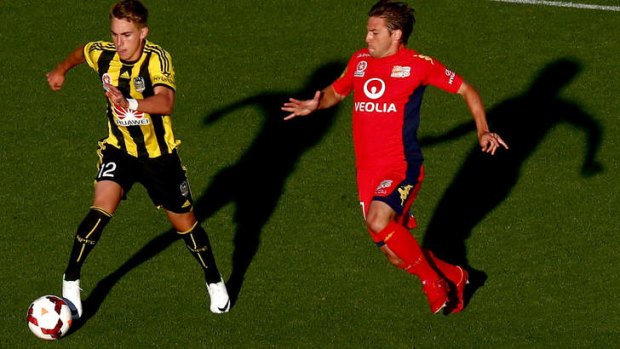 Tyler Boyd is closed down by Jeronimo Neumann of Adelaide.