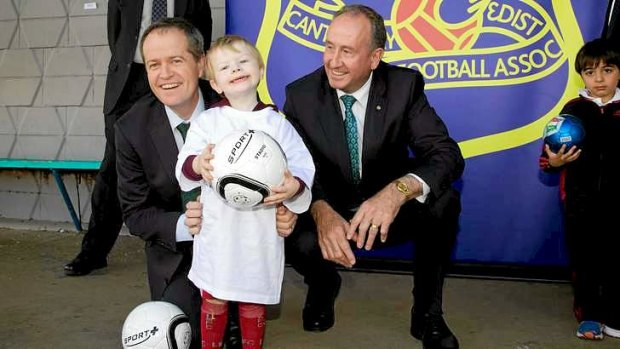 Three amigos: Minister Bill Shorten, left, and member for Reid John Murphy with Oliver Lucas, 2, at Concord.