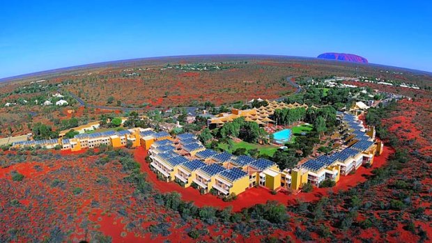 In the red: The Ayers Rock Resort in central Australia, bought by the Indigenous Land Corporation, with Uluru in the background.