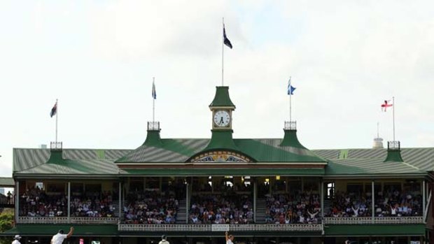 Got 'em ... Chris Tremlett celebrates Mitchell Johnson's golden duck as those in the SCG members' pavilion look on in horror yesterday.