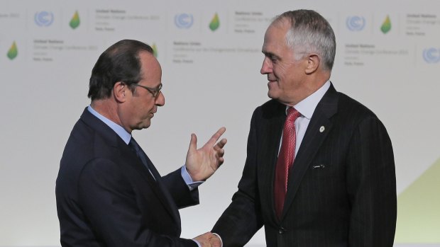 Francois Hollande greets Malcolm Turnbull as he arrives for the UN climate conference.