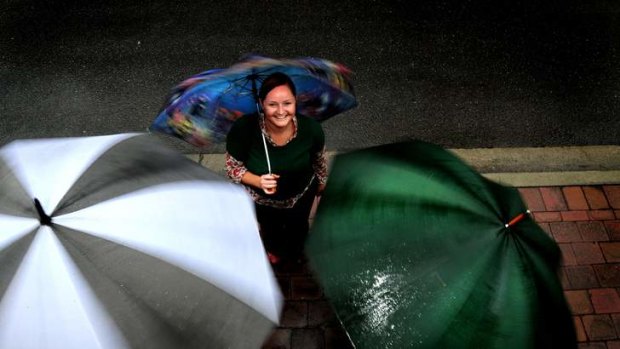 Kate McMahon, 35, of O'Connor was well prepared for the wet weather  in Canberra.