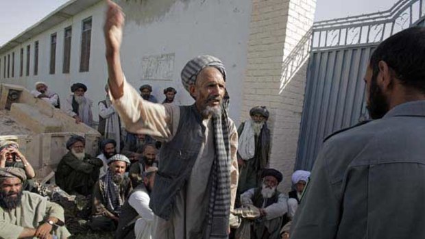 Elders in Afghanistan's Arghandab district, near the southern city of Kandahar, plead with police for the release of several men detained on suspicion of links to the Taliban.