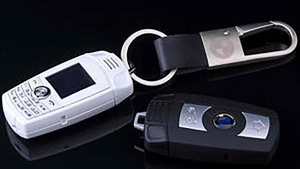 Deceptive: The BMW key-ring phones, sold for as little as $30 in China.