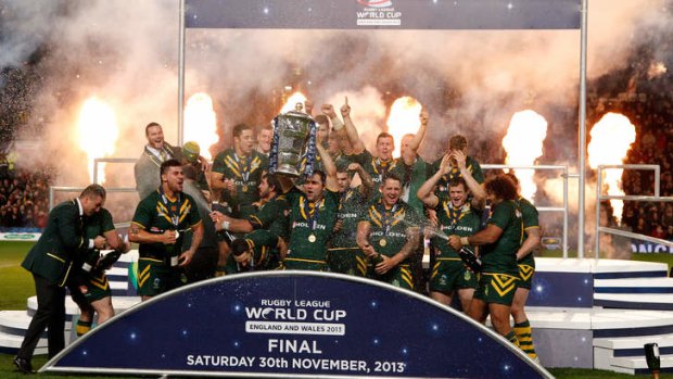 World champions: The Kangaroos celebrate after their 34-2 defeat of New Zealand in the World Cup final at Old Trafford.