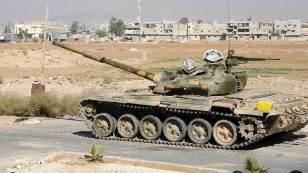A tank in an empty street in the al-Bouydah district of the Syrian capital Damascus.