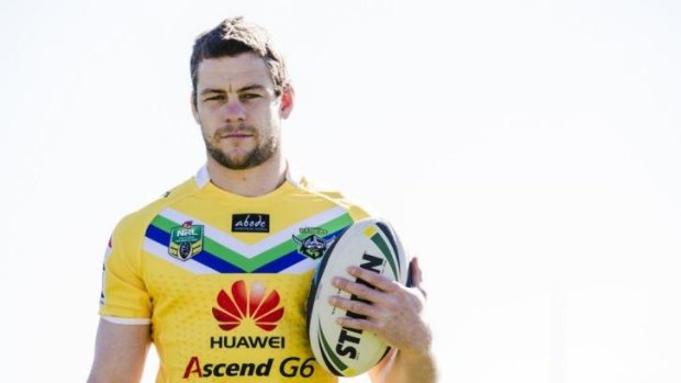 Canberra Raiders lock Shaun Fensom models the yellow jersey the side will wear against North Queensland on Sunday.