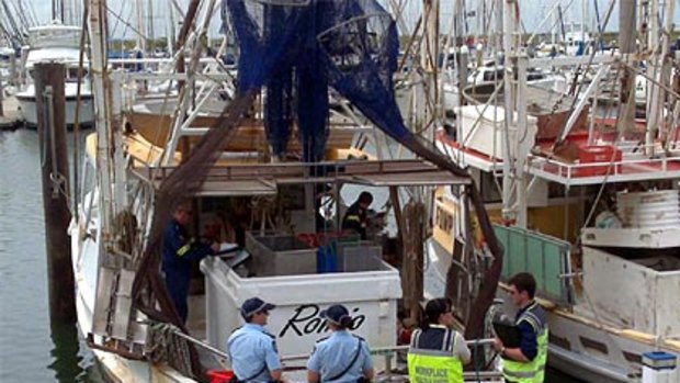 Police investigate an explosion on board fishing trawler Romio at Scarborough Boat Harbour today.