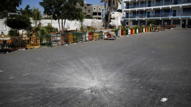 A crater from a shell in the courtyard of the school.