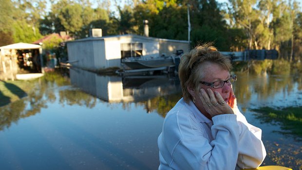 Nathalia resident Pat Butler takes a break after her house flooded.