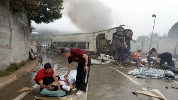 Victims receive help after a train crashed near Santiago de Compostela, northwestern Spain.
