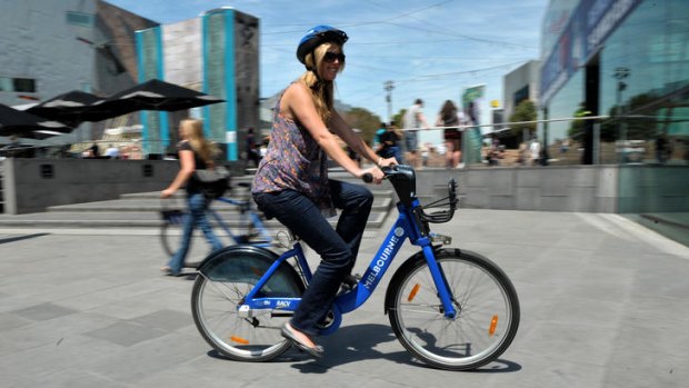 Melbourne's bikes for hire scheme has hit some big hurdles, namely the compulsory helmets that riders need to wear.