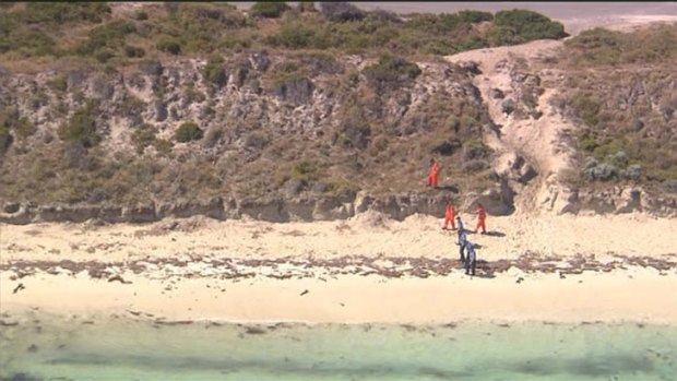 Forensic officers search a large area of Rottnest Island after the discovery of a man's head washed up on the beach.