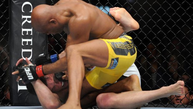 Anderson Silva (yellow trunks) goes for the kill during his UFC 148 middleweight championship fight against Chael Sonnen at the MGM Grand Garden Arena.