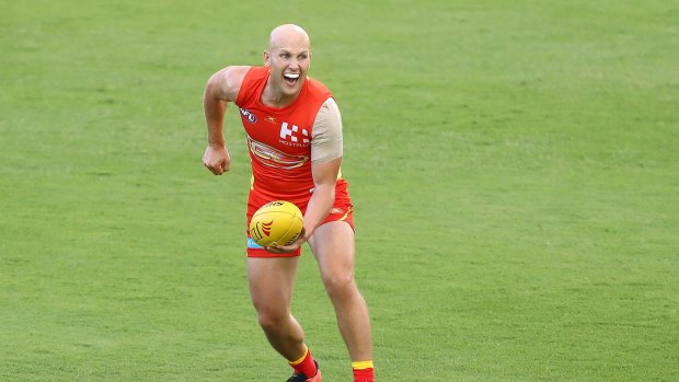 GOLD COAST, AUSTRALIA - MARCH 09: Gary Ablett of the Suns handballs during the JLTR Community Series AFL match between the Gold Coast Suns and the Western Bulldogs at Metricon Stadium on March 9, 2017 in Gold Coast, Australia. (Photo by Chris Hyde/Getty Images)