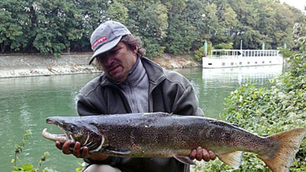 They're back ... A fisherman shows off the Atlantic salmon he caught in the Seine in Suresnes, outside Paris. It weighed 7 kg.