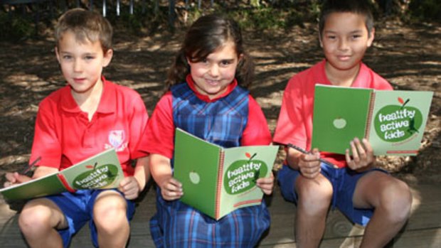Eat our words ... Coogee  students Jacob, Matina and Alistair with their Healthy Active Kids journals.
