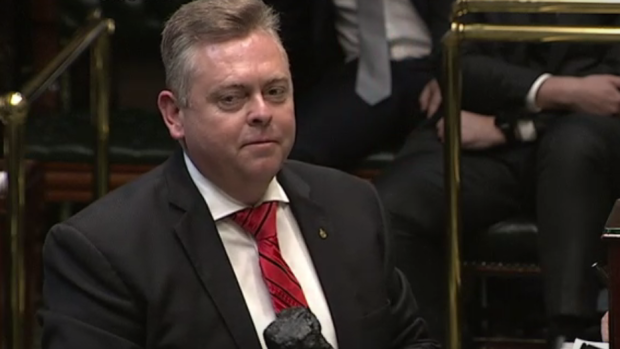 Anthony Roberts with the lump of coal in Parliament. 