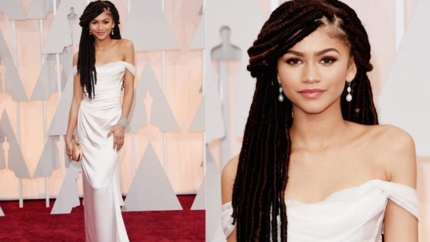 Tween actress Zendaya adds edge to a simple white gown with a great big mane of dreads.