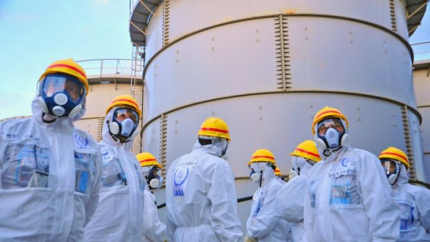 Review mission members of the International Atomic Energy Authority  at Fukushima No.1 nuclear power plant late last year. 