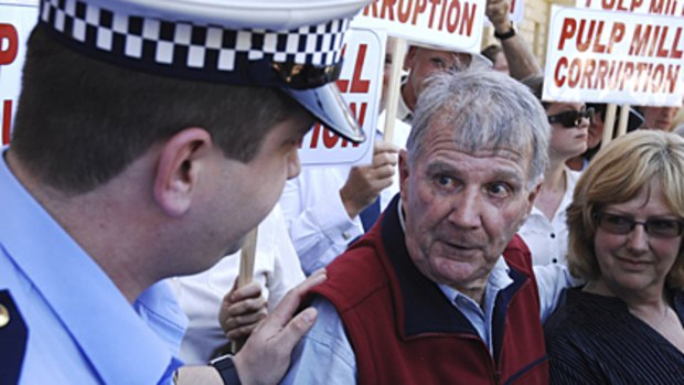 His bloomin' lot ... Peter Cundall is arrested outside Tasmania's Parliament House in Hobart yesterday.
