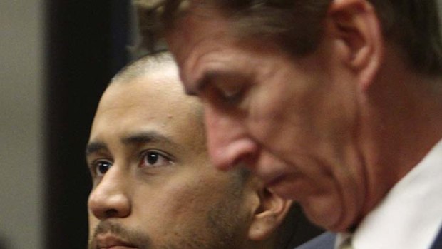 Charged ... George Zimmerman, left, appears in court.
