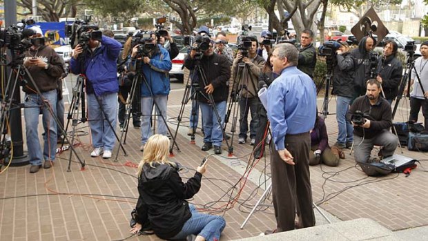 Los Angeles County sheriff's spokesman Steve Whitmore takes questions from the media outside the West Hollywood sheriff's station